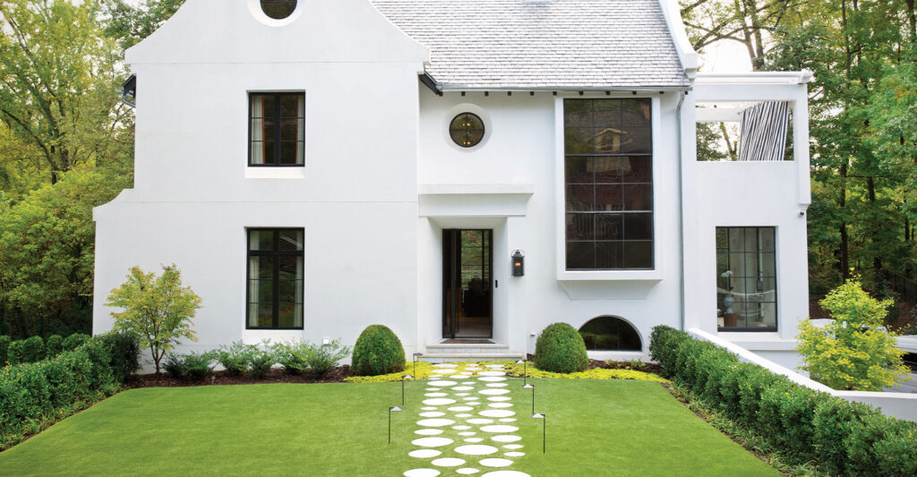 Modern white house with outdoor lighting