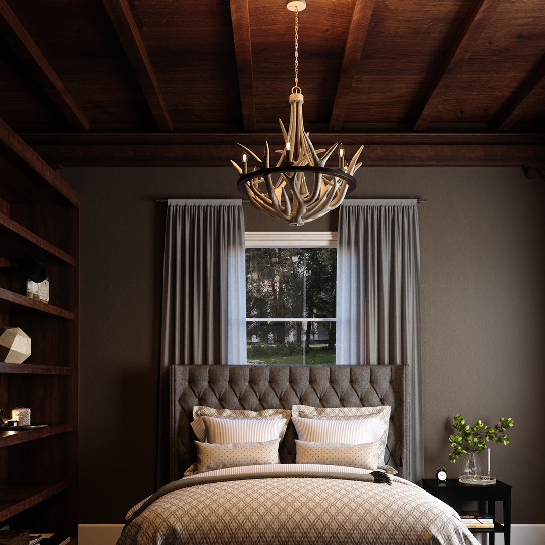 A chandelier made out of antlers in a nice bedroom