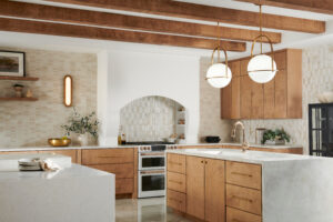 Elegant gold pendant lights hanging over a kitchen island, showcasing a contemporary style and providing focused lighting to the workspace. Elegant gold pendant lights hanging over a kitchen island, showcasing a contemporary style and providing focused lighting to the workspace.