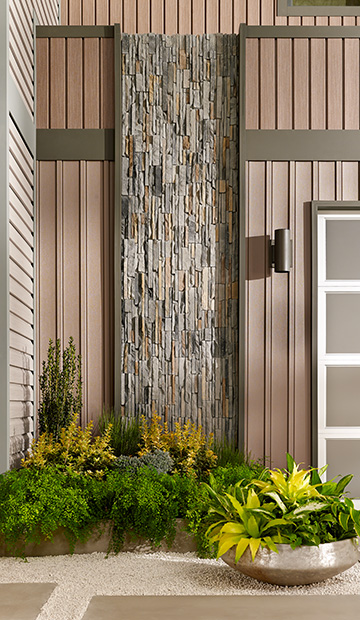 An outdoor sconce by exterior accent wall