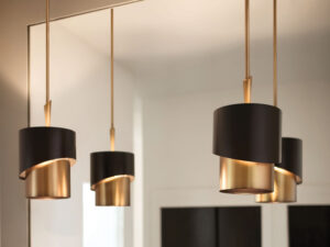Stylish bathroom showcasing two black and gold pendant fixtures from Franklin Lighting. The bold, contemporary design of the pendants adds a touch of luxury above the vanity, beautifully contrasting with the light, neutral tones of the space, creating a sophisticated ambiance.