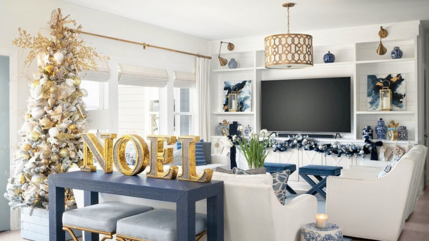 Elegant chandelier from Franklin Lighting illuminating a cozy living room with a beautifully decorated Christmas tree, creating a festive and warm holiday ambiance.