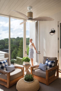Damp-rated ceiling fan in screened Sarasota lanai with tropical decor