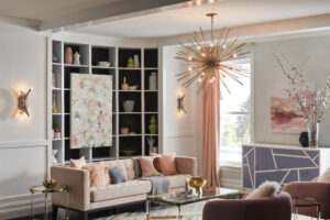 Living room with layered lighting chandelier and two sconces from franklin lighting