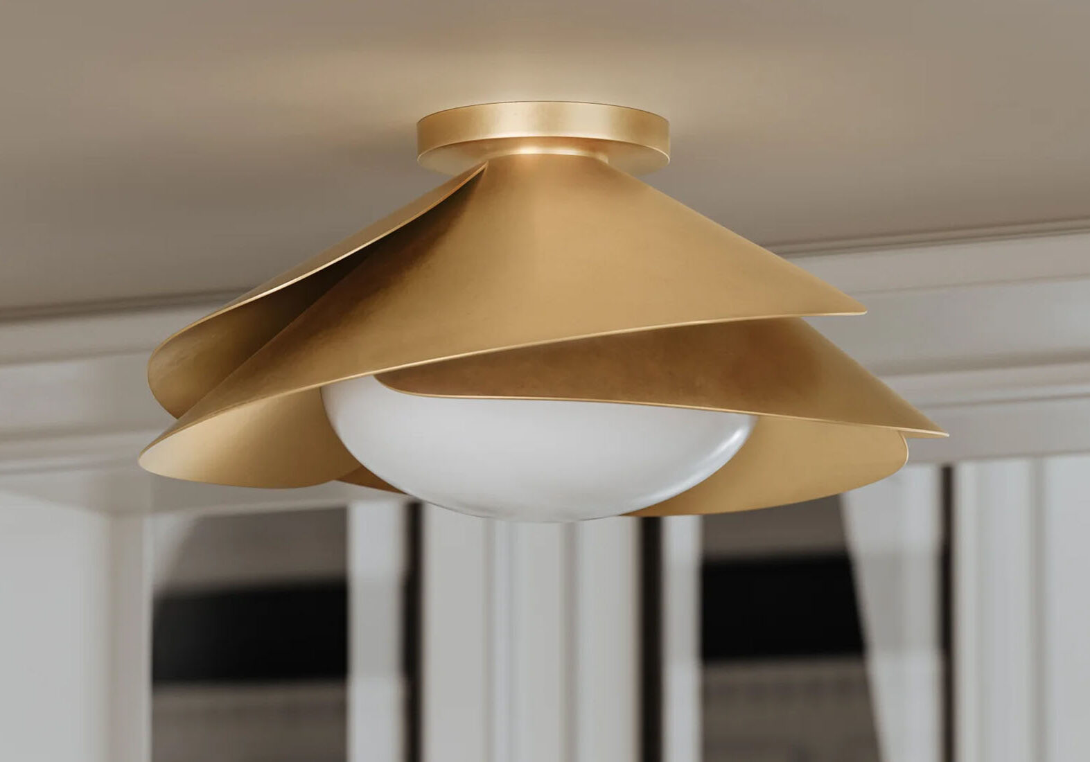 Handcrafted gold architectural flush mount ceiling light with a frosted globe.