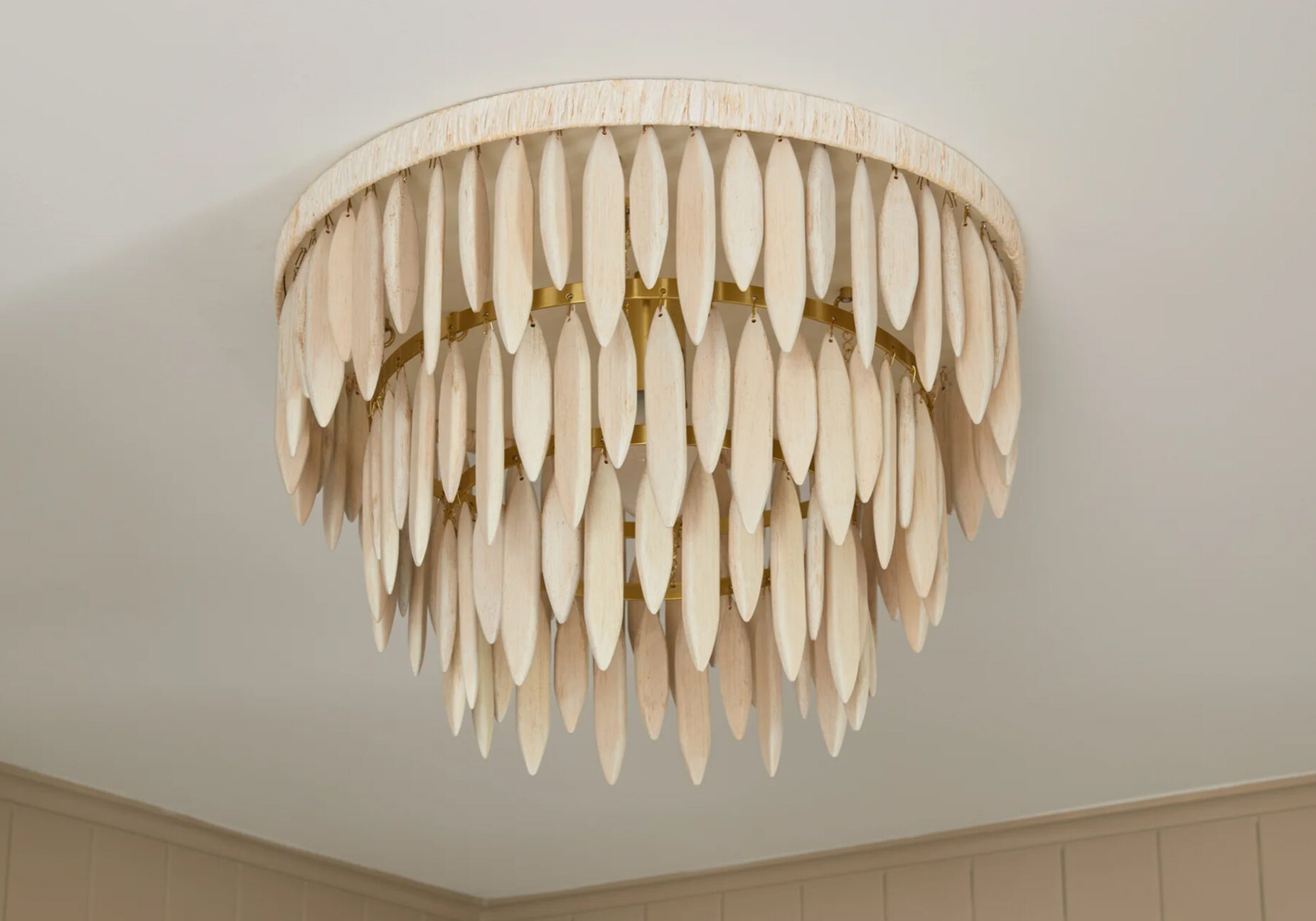 Handcrafted tiered leaf-style chandelier in a matte cream finish.