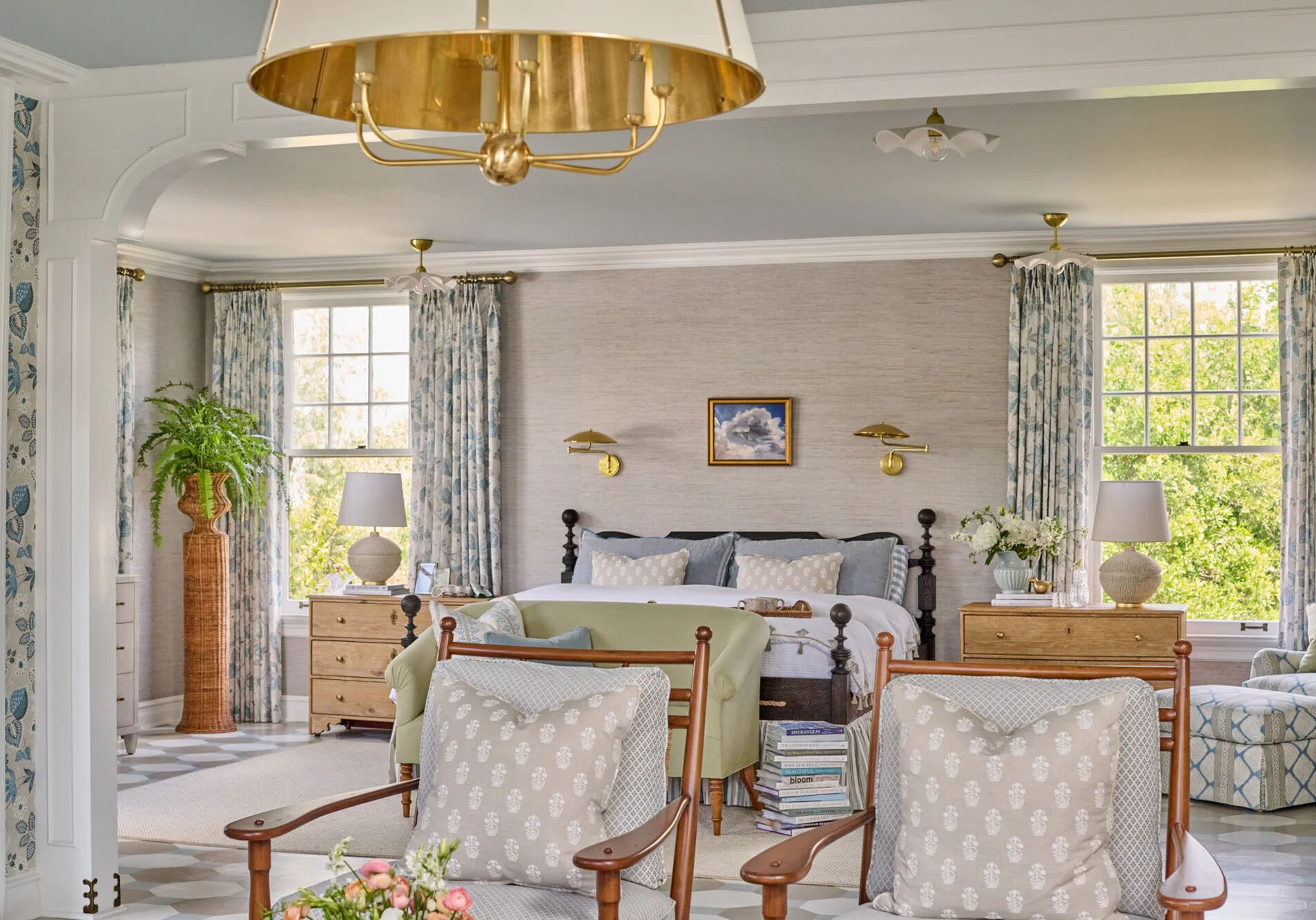 Spacious living area featuring a large custom made gold drum chandelier.